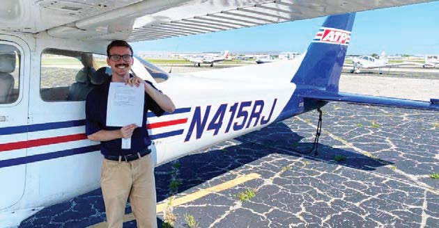 Sam Lilley poses after earning his private pilot certificate. [Courtesy: Tim Lilley]