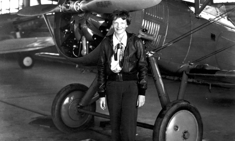 In this photo taken in 1935, Amelia Earhart stands in front of a Boeing P-12 at March Field in California. [Credit: National Archives]