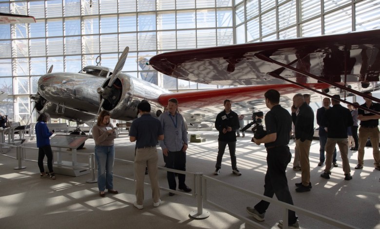 The expedition team gets a close-up look at a Lockheed Electra similar to the one flow by Amelia Earhart at the Museum of Flight in Seattle. [Courtesy: Ted Huetter/Museum of Flight]