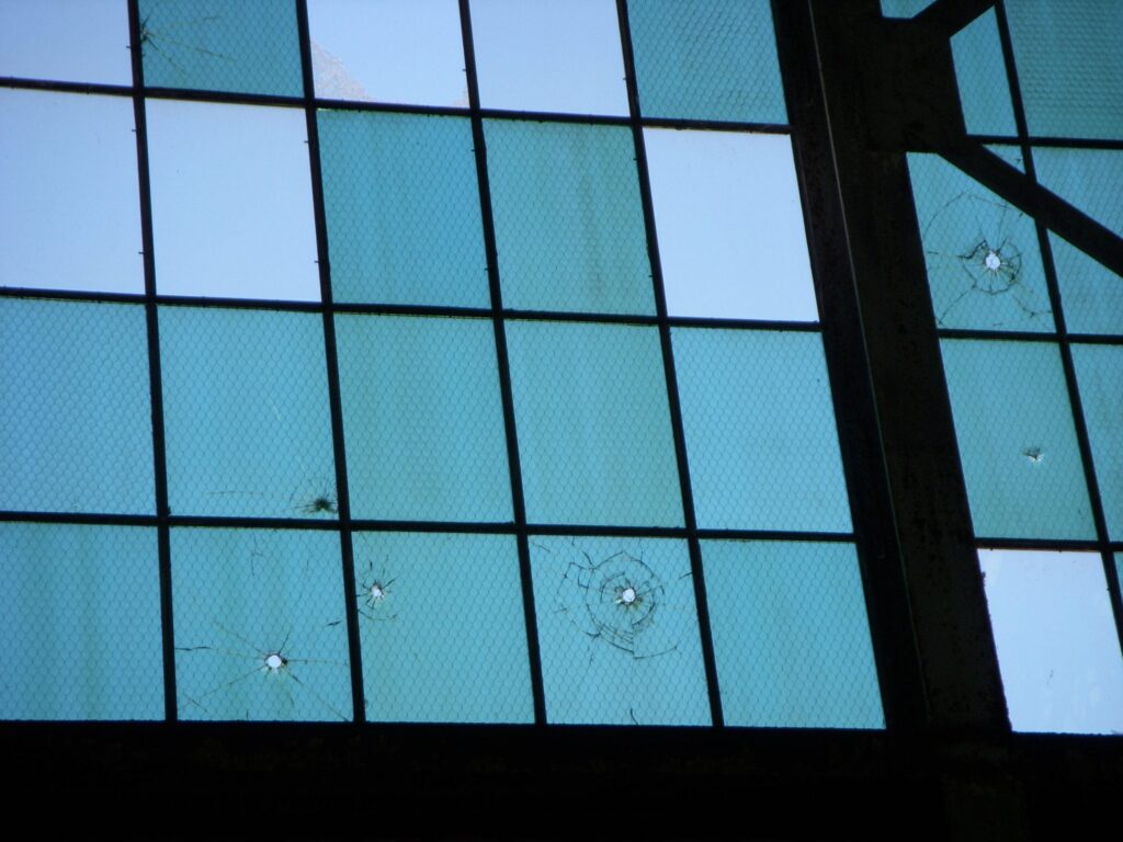 A building at the Pearl Harbor Aviation Museum still shows damage from the December 7, 1941, attack, including bullet holes in the windows and pavement. [Credit: Pearl Harbor Aviation Museum]