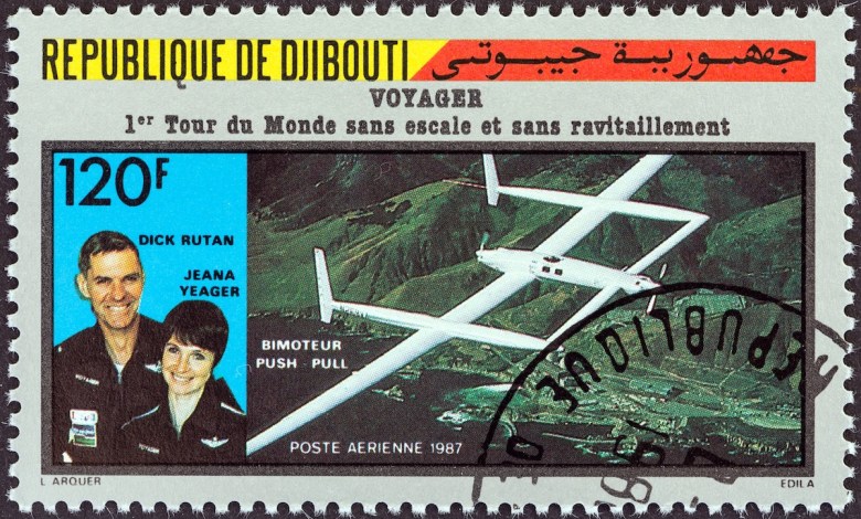 A stamp printed in Djibouti issued for the first flight around the world without stopping or refueling by Rutan Model 76 Voyager shows Dick Rutan and Jeana Yeager, circa 1987.