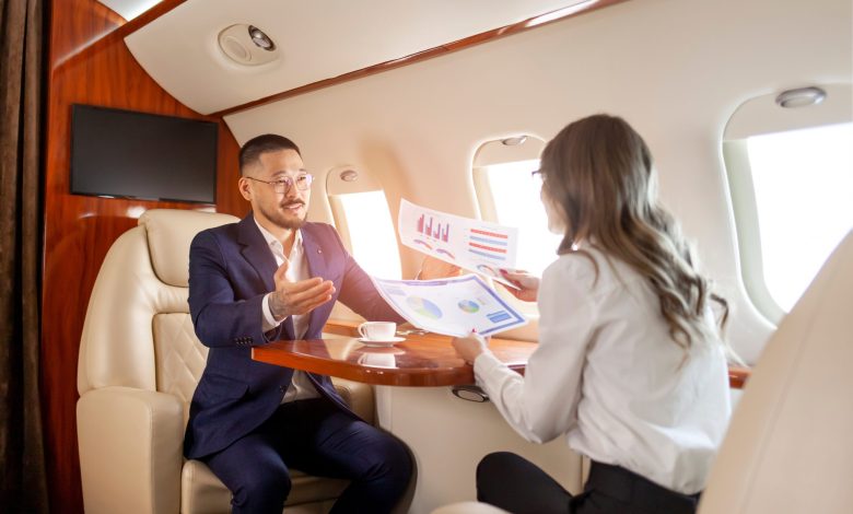 Business meeting in jet cabin [Shutterstock]