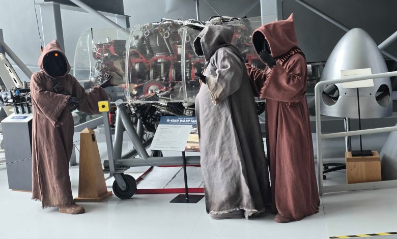 Folks dressed as Jawas are seen on the floor of the Evergreen Aviation & Space Museum in McMinnville, Oregon, during its Star Wars Day event in 2025. [Courtesy: Lee Ngo/EASM]
