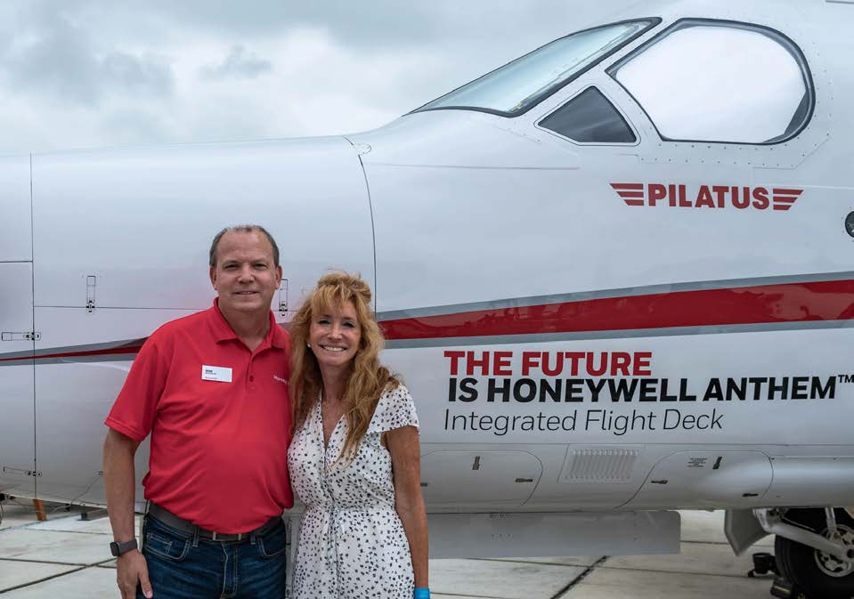 GoAERO CEO Gwen Lighter (right) poses with Bob Buddecke, president of electronic solutions at Honeywell—one of the competition’s many sponsors. [Courtesy: GoAERO]