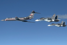 A Russian Tu-134UBL nicknamed "Black Pearl" by Western security experts, at left.