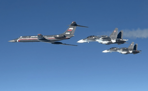 A Russian Tu-134UBL nicknamed "Black Pearl" by Western security experts, at left.