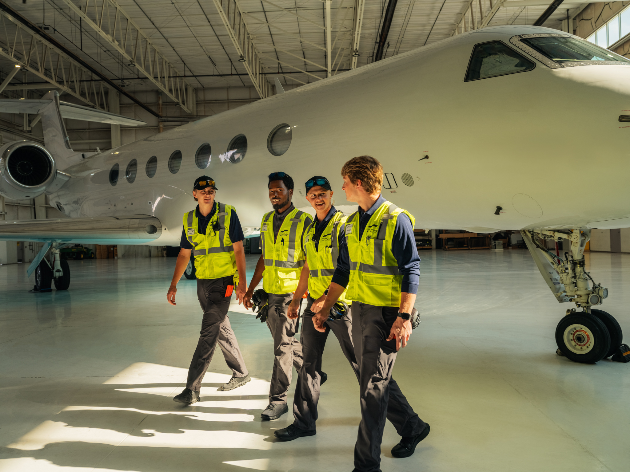 Signature Aviation employees.