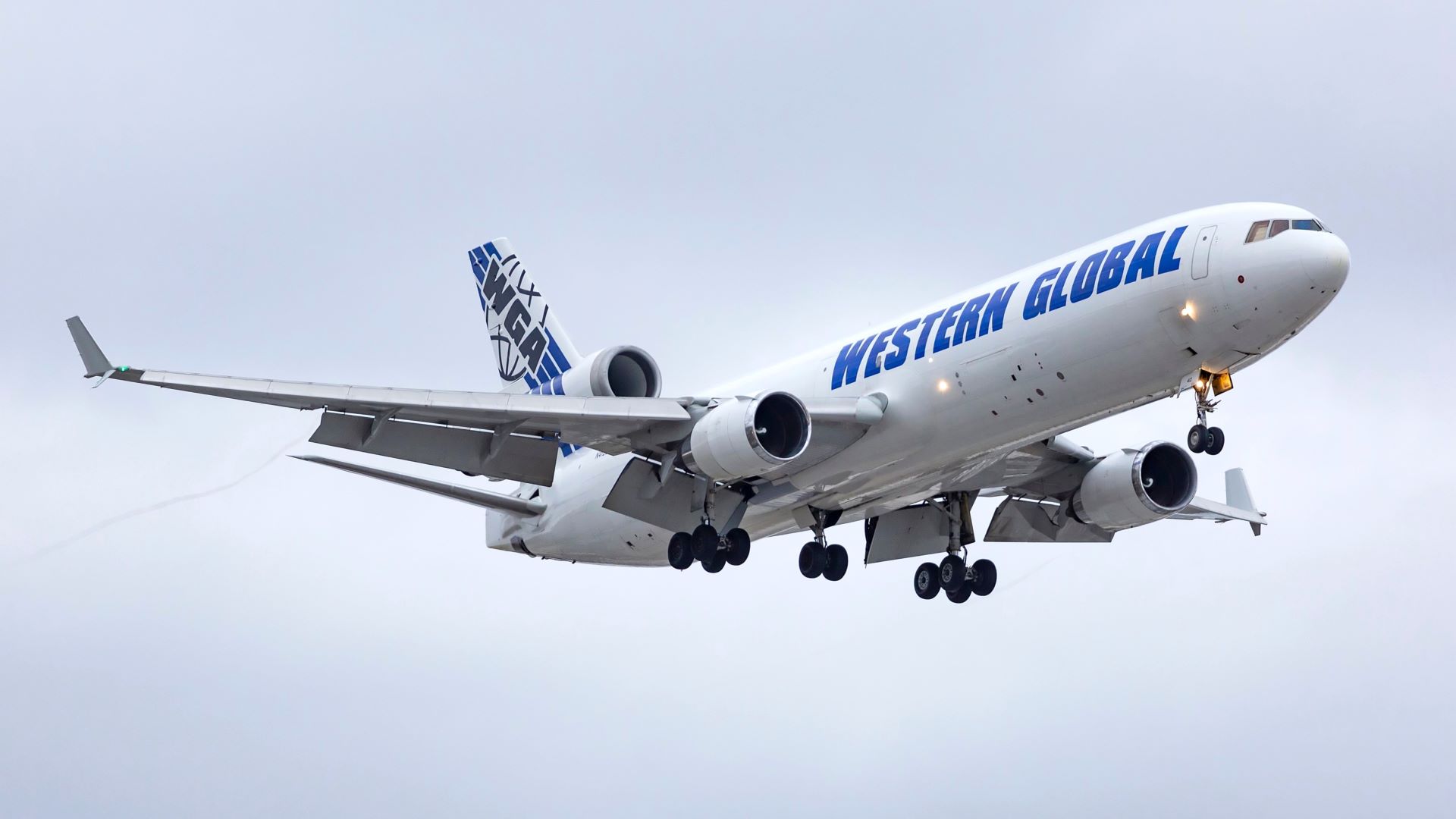 An MD-11 freighter aircraft operated by Western Global Airlines makes its final approach to Chicago O’Hare International Airport on Oct. 26, 2020. [Credit: Shutterstock/Carlos Yudica]