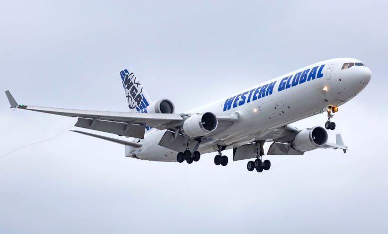 An MD-11 freighter aircraft operated by Western Global Airlines makes its final approach to Chicago O’Hare International Airport on Oct. 26, 2020. [Credit: Shutterstock/Carlos Yudica]
