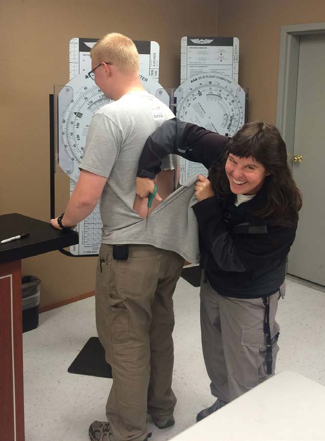 Meg Godlewski (right) and Adam ‘Stork’ Castle celebrate his first solo flight. [Credit: Meg Godlewski]