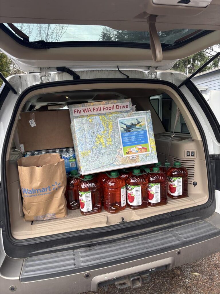 Trunk holds the donations from Harvey Field in Washington State to be donated to the Snohomish Food Bank . [Credit:  Marjy Leggett]