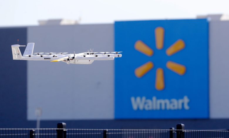Wing delivery drone flying in front of Walmart store