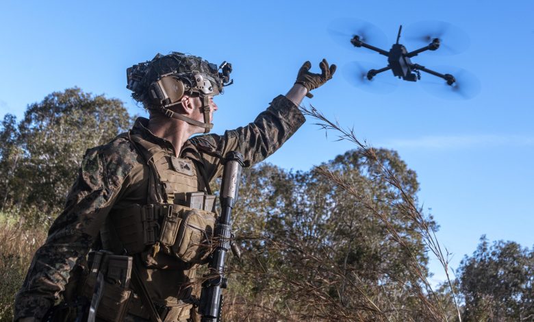 U.S. military personnel deploys a small UAS drone