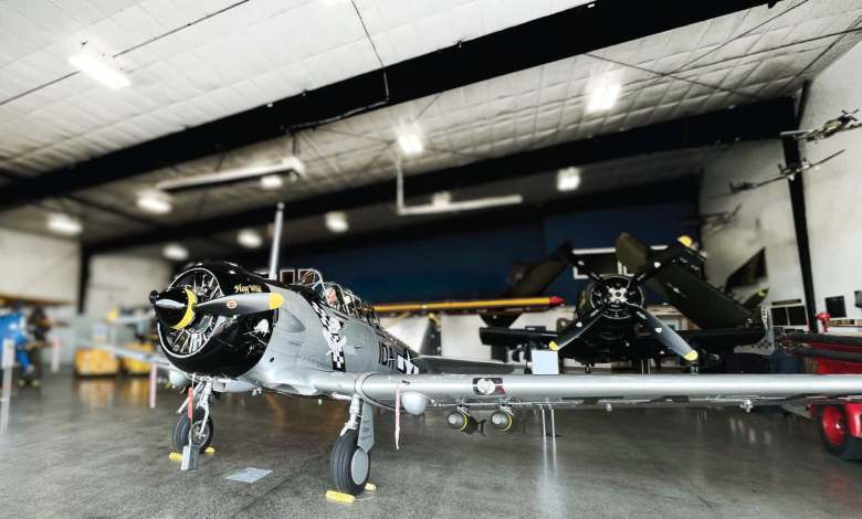 An open hangar door at the Heritage Flight Museum reveals a T6D Texan, Hog Wild Gunner. [Credit: Meg Godlewski]