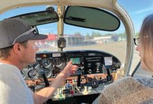 A pilot briefs their passenger on the upcoming flight [Credit: Meg Godlewski]