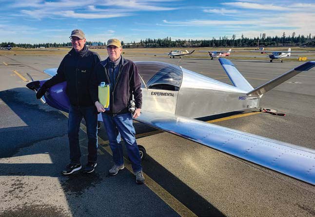 BACE co-founder Mike Friend (left) and Joel Mapes of EAA Chapter 406 commemorate the first eXenos sortie. [Credit: George Steed]