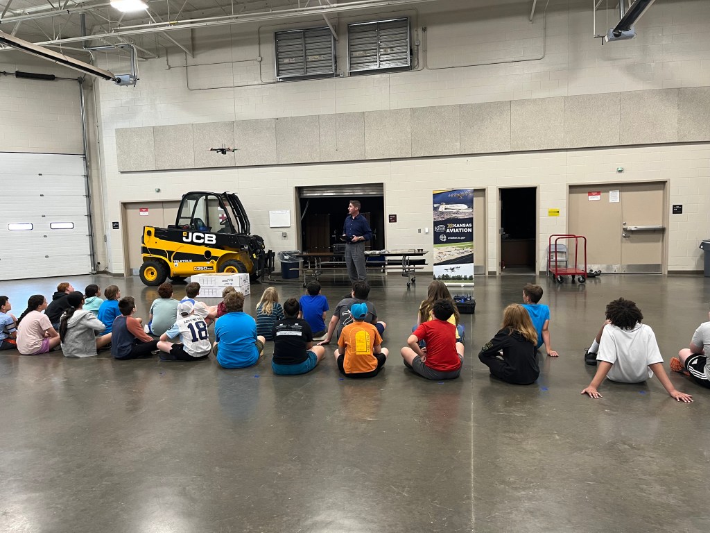 KDOT Aviation’s Brian Kassin flies a drone and discusses drone and aviation careers with students at one of the department's outreach events [Credit: Kansas Department of Transportation]