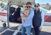 Wildlife rescuers Ken Wayne and his wife, Carole Moshetti, and their dog Mango. [Credit: Flying Tails]