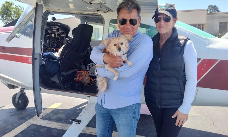 Wildlife rescuers Ken Wayne and his wife, Carole Moshetti, and their dog Mango. [Credit: Flying Tails]
