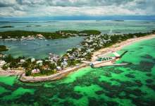 One of the most recognizable sights in the Abacos Islands in the northern Bahamas is the red-and-white-striped Elbow Reef Lighthouse. [Credit: Glenn Watson]