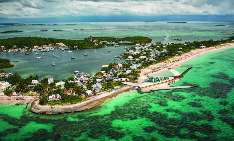 One of the most recognizable sights in the Abacos Islands in the northern Bahamas is the red-and-white-striped Elbow Reef Lighthouse. [Credit: Glenn Watson]
