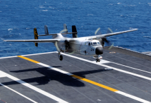 A C-2A Greyhound assigned to the Providers of Fleet Logistics Support Squadron 30 lands aboard the aircraft carrier USS Nimitz. [Credit: U.S. Navy photo by Mass Communication Specialist 3rd Class Peter Merrill]