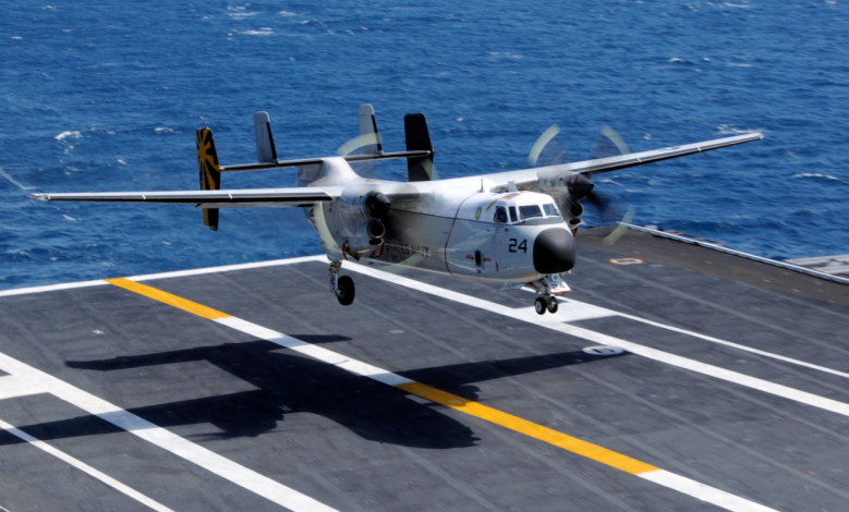 A C-2A Greyhound assigned to the Providers of Fleet Logistics Support Squadron 30 lands aboard the aircraft carrier USS Nimitz. [Credit: U.S. Navy photo by Mass Communication Specialist 3rd Class Peter Merrill]