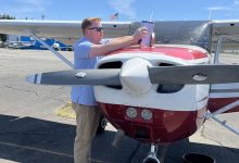 Student pilot uses a checklist during preflight process. [Credit: Meg Godlewski]