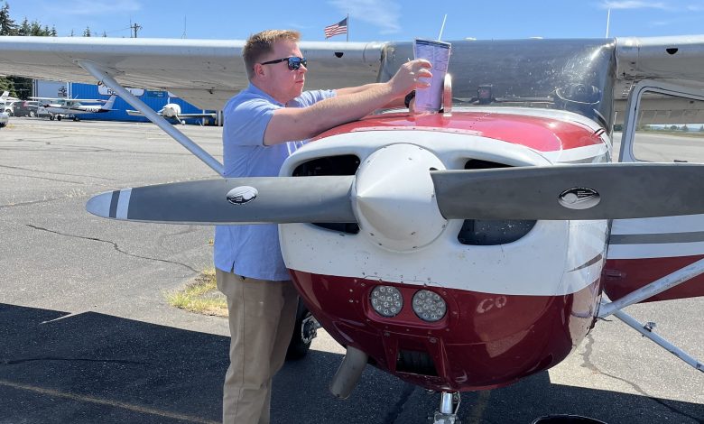 Student pilot uses a checklist during preflight process. [Credit: Meg Godlewski]