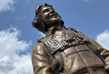 There’s a new statue in the warbirds section at Oshkosh that honors C.E. ‘Bud’ Anderson, a onetime fan favorite at EAA AirVenture. [Credit: Meg Godlewski]
