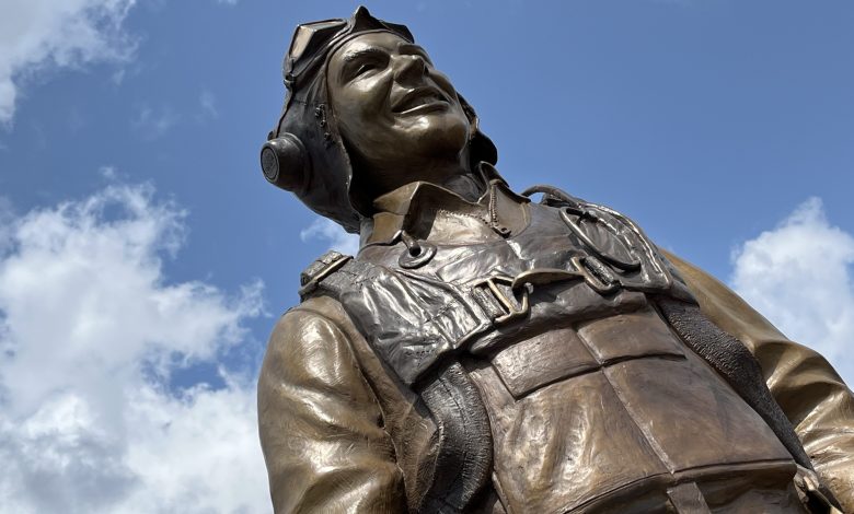 There’s a new statue in the warbirds section at Oshkosh that honors C.E. ‘Bud’ Anderson, a onetime fan favorite at EAA AirVenture. [Credit: Meg Godlewski]
