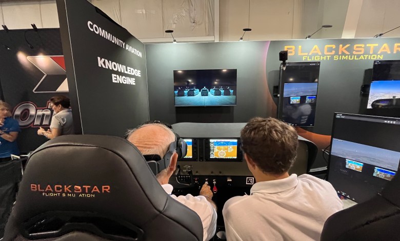 Attendees try out the Blackstar Eclipse Advanced Aviation Training Device at AirVenture. [Credit: Meg Godlewski]