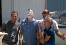 The author (far right) has cut off a few shirttails and plopped a few pies in the faces of first-solo pilots. [Credit: Martha Lunken]