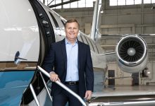Chris Rocheleau standing in front of business jet