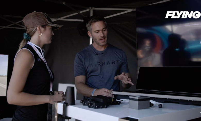 Plane + Pilot magazine’s Cayla McLeod (left) talks with Nate Thuli, president of Airhart Aeronautics, at EAA AirVenture in July. [Credit: FLYING]