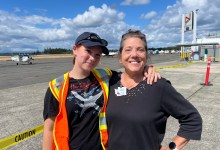 Trish WIlliams (right) poses with Violet Weir, a senior in high school who has been building airplanes with EAA Chapter 406 for several years. Weire has earned several scholarships and is pursuing her pilot certificate. [Credit: Meg Godlewski]