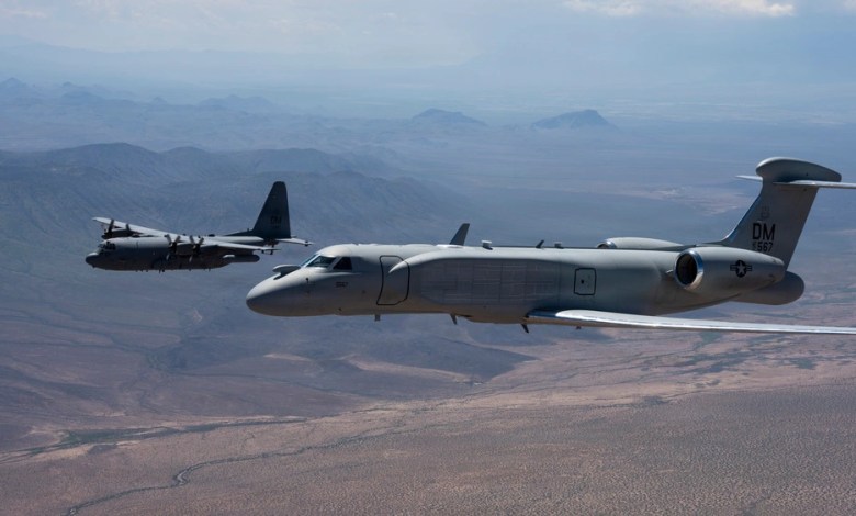 U.S. Air Force EC-130H Compass Call aircraft formation flight with EA-37B