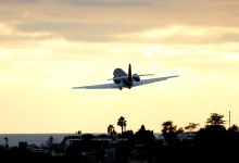 business jet taking off from airport