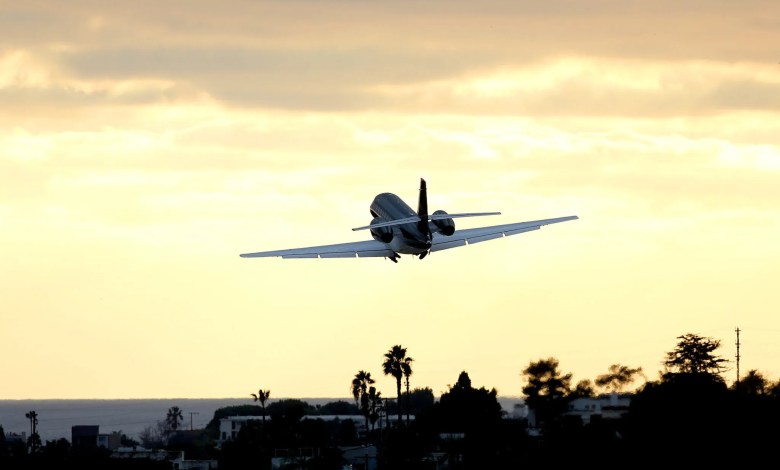 business jet taking off from airport