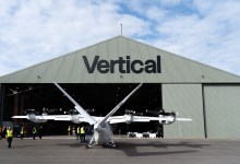 Vertical Aerospace air taxi assembly center at Cotswold Airport with prototype Valo aircraft standing in front