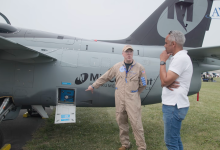Matthew Harrah (left) talks to The Aviation Consumer lead editor Jonathan Welsh (about the True Blue Power Gen5 TB50 at Oshkosh. [Credit: FLYING]