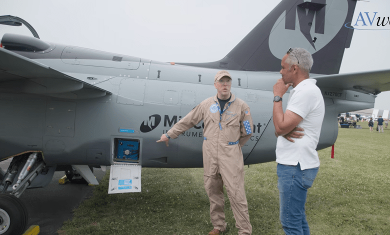 Matthew Harrah (left) talks to The Aviation Consumer lead editor Jonathan Welsh about the True Blue Power Gen5 TB50 at Oshkosh. [Credit: FLYING]