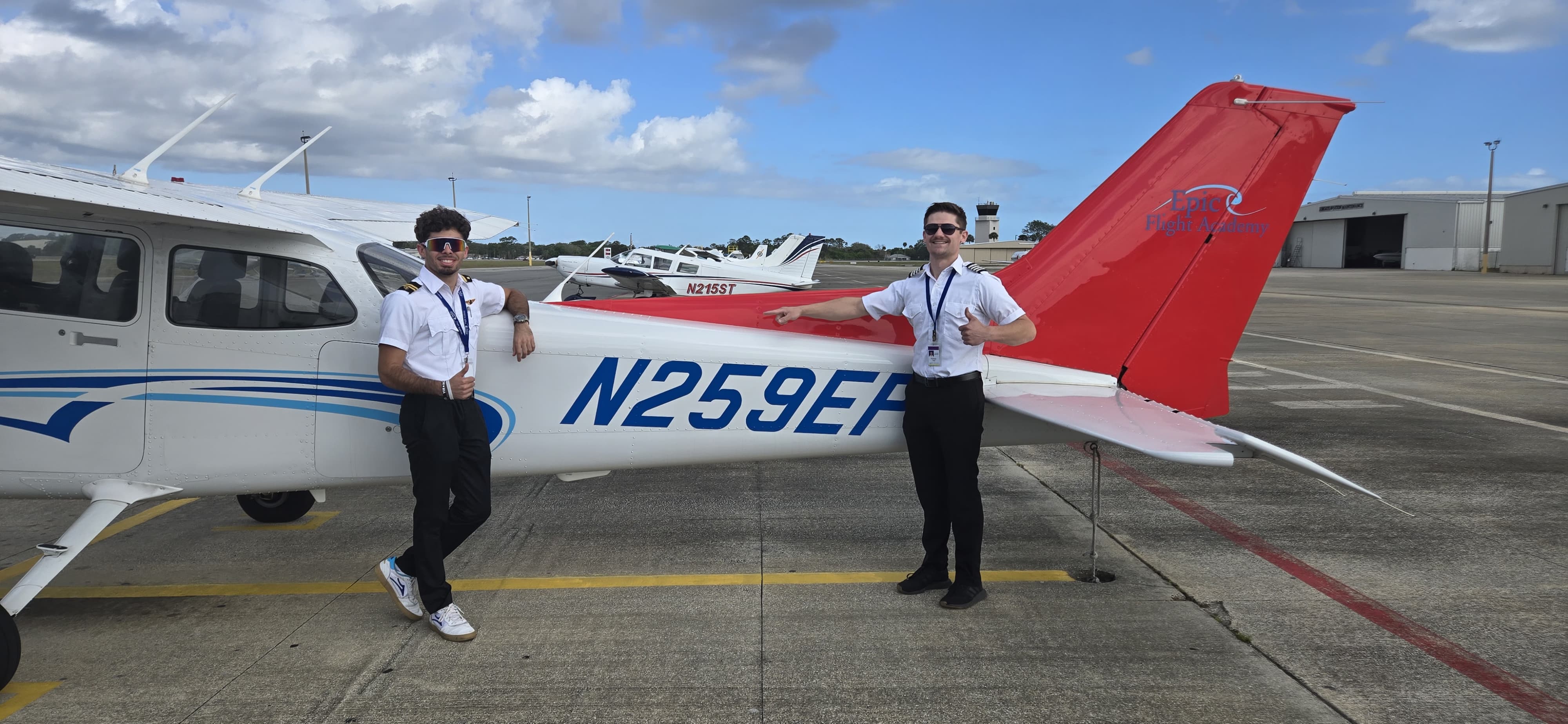Shemuel Ortiz (left), who won a $20,000 pilot scholarship from Epic Flight Academy in 2023, poses with instructor Kyle Mooney after passing the CSEL in June 2026. [Credit: Epic Flight Academy]