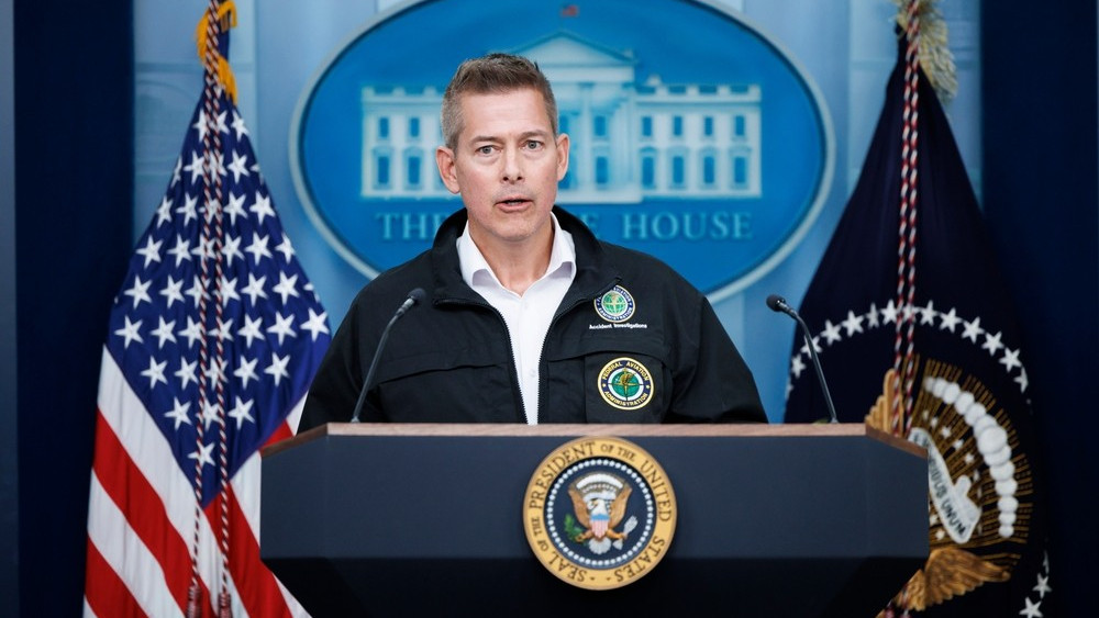 U.S. Transportation Secretary Sean Duffy stands at a podium