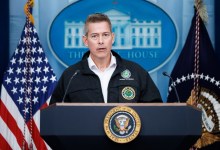 U.S. Transportation Secretary Sean Duffy stands at a podium