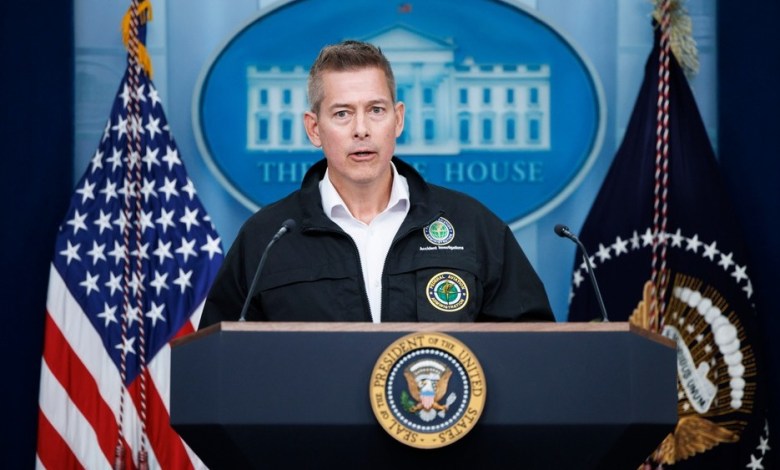 U.S. Transportation Secretary Sean Duffy stands at a podium