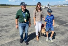 Angel Flight pilot Kirk Walters (left) walks next to Ali Hamm, Lava, and her son, Calvin, who has flown on nearly 50 Angel Flights. [Credit: Matt Leighton]