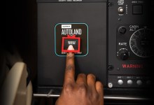 person pushing Garmin Autoland button