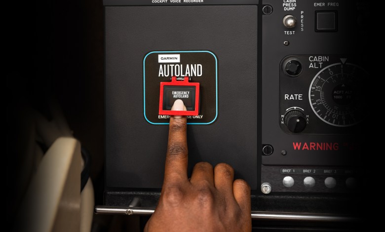 person pushing Garmin Autoland button
