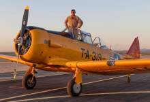 Karl Gashler poses with his T-6, a legendary airplane that trained thousands of World War II aviators for the rigors of flying fighter aircraft. [Credit: David McKay]